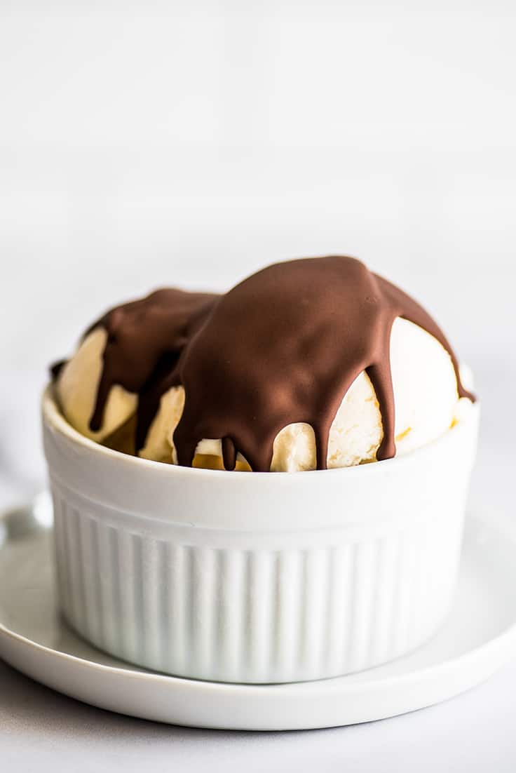 Chocolate shell on vanilla ice cream.