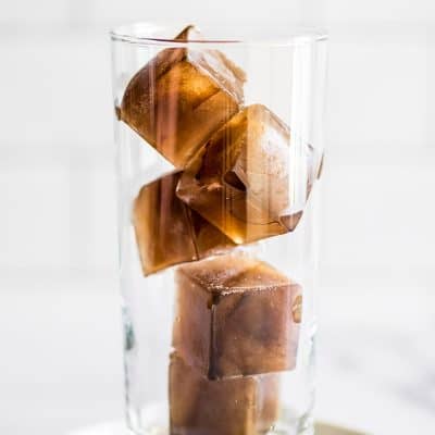 Coffee ice cubes in a glass.