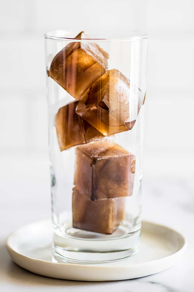 Coffee ice cubes in a glass.