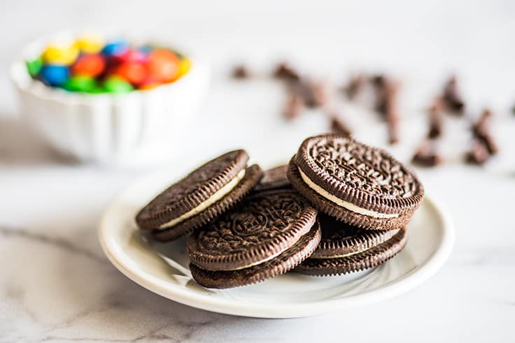 Oreos for a milkshake on a plate.