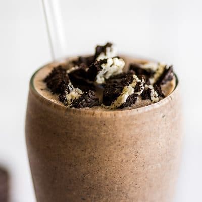 Oreo milkshake with oreo pieces on top.