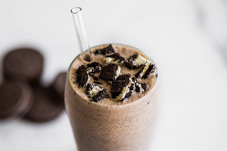 Oreo milkshake with oreo pieces on top.