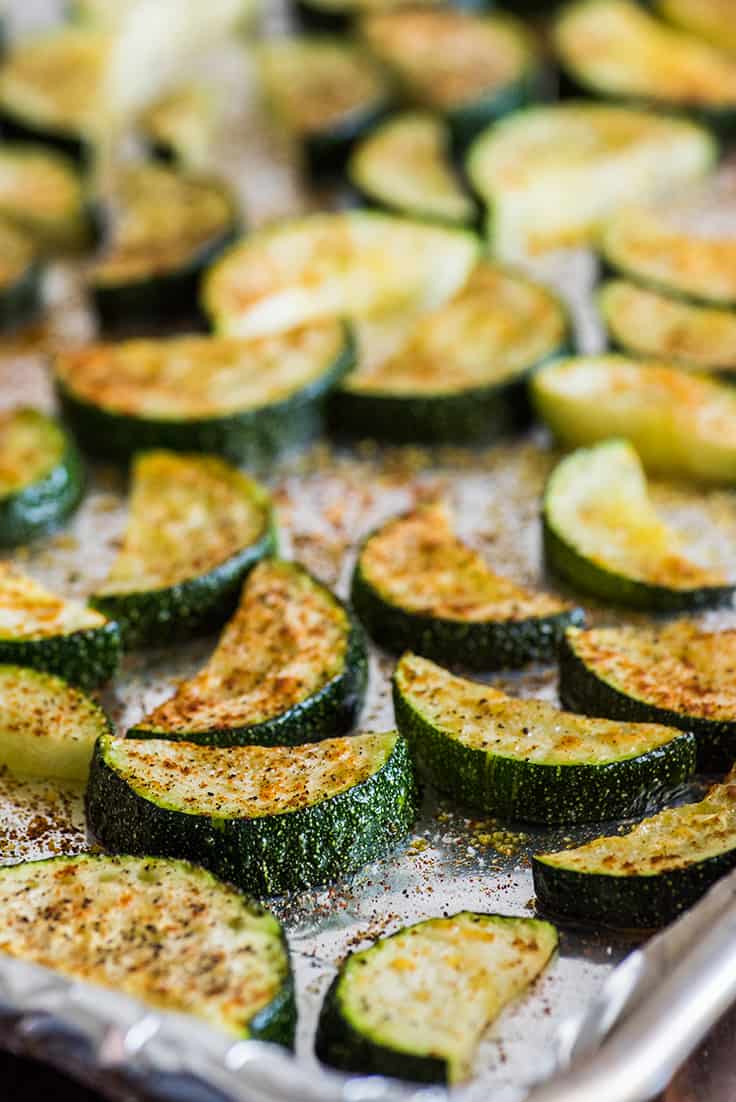 Roasted zucchini on baking sheet.