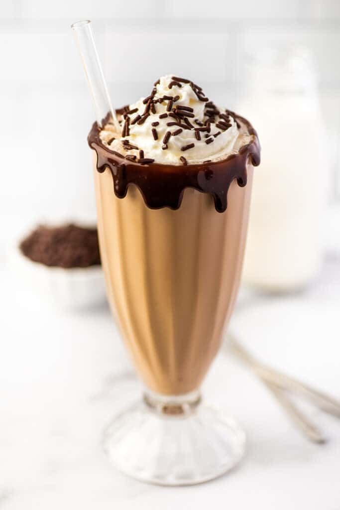 Chocolate milkshake in a tall glass.