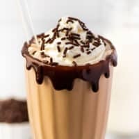 Chocolate milkshake in a tall glass.