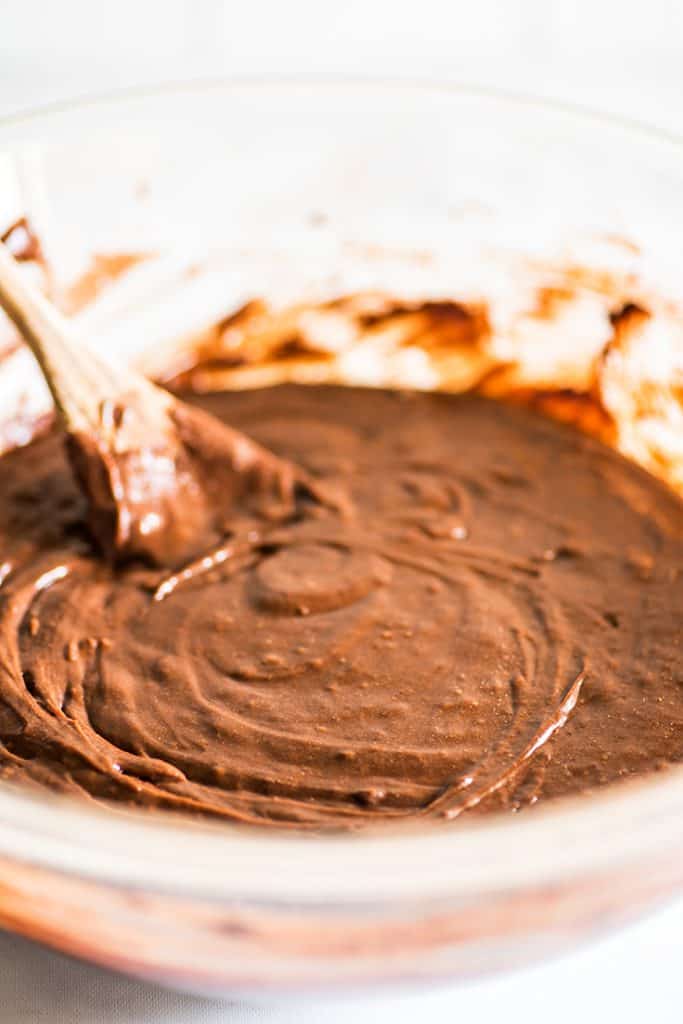 Image of brownie batter in a glass bowl.