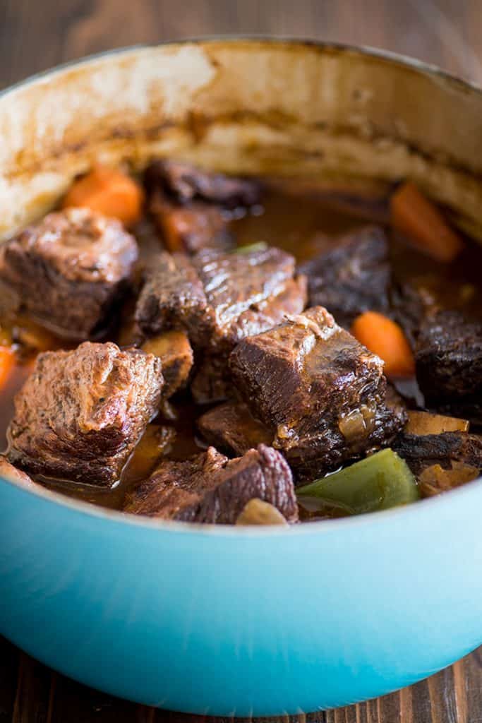Picture of easy braised short ribs in a blue pot.