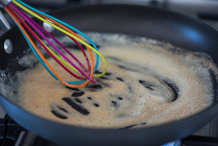 Browning flour on the stove for easy gravy recipe.