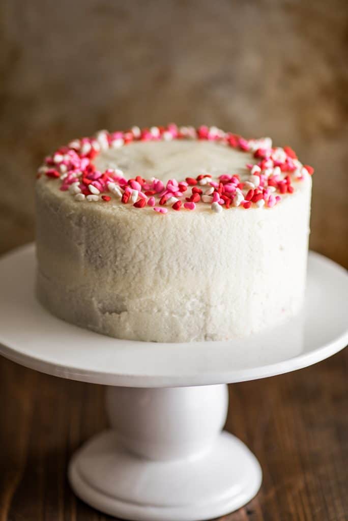 Image of Small Red Velvet Cake on a white cake platter.
