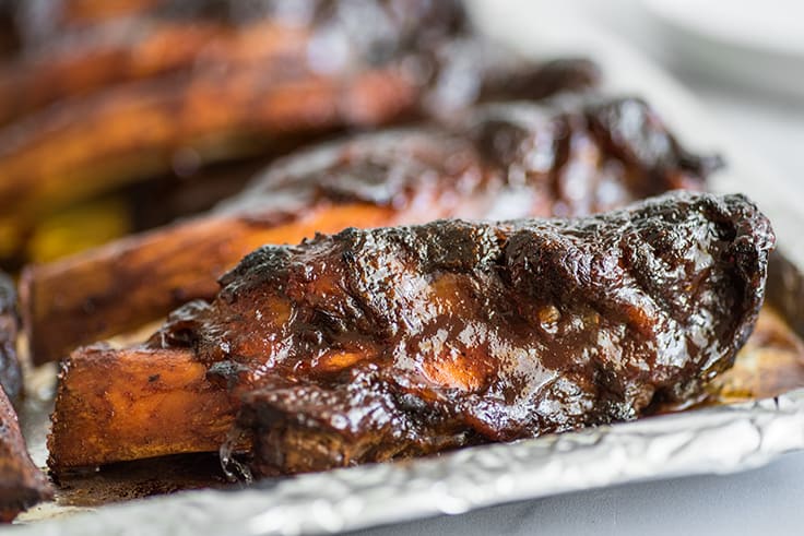 Beef back ribs on a baking sheet.