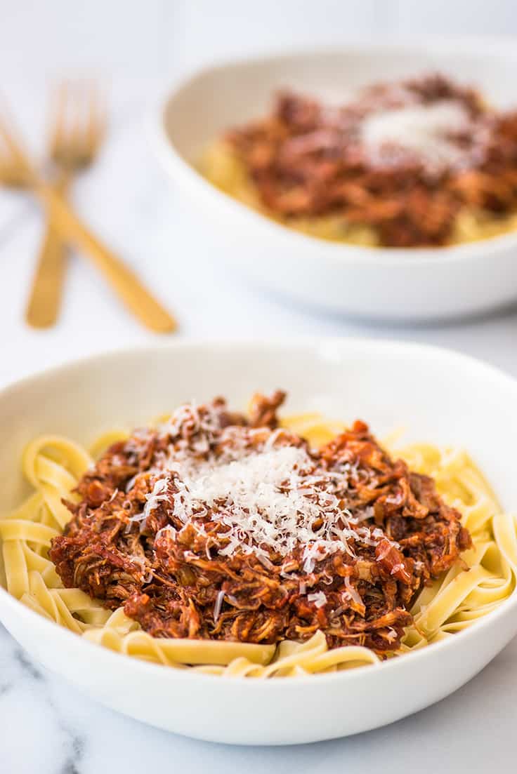 Pork ragu in a white bowl.