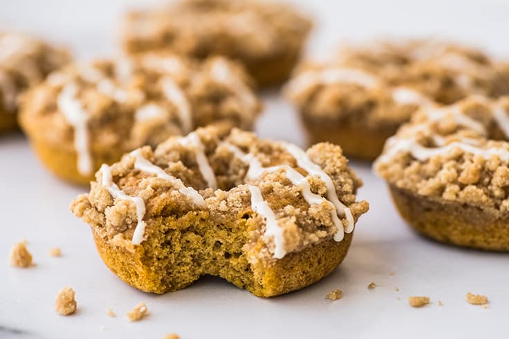 Pumpkin Donut With Streusel with a bite out of it.