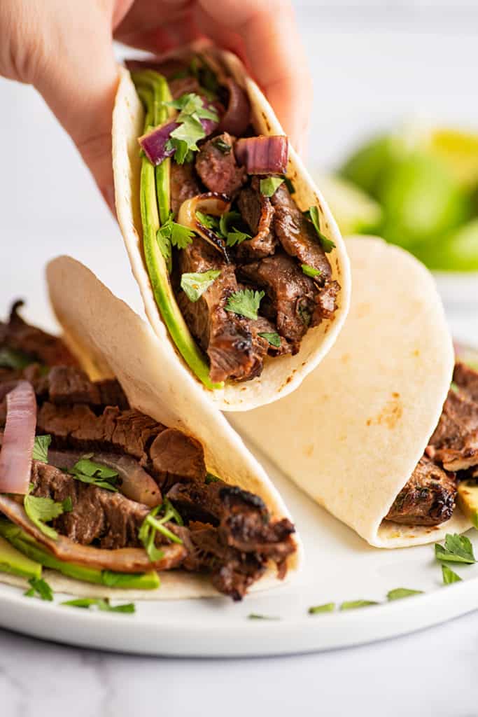 Carne Asada Taco being picked up.