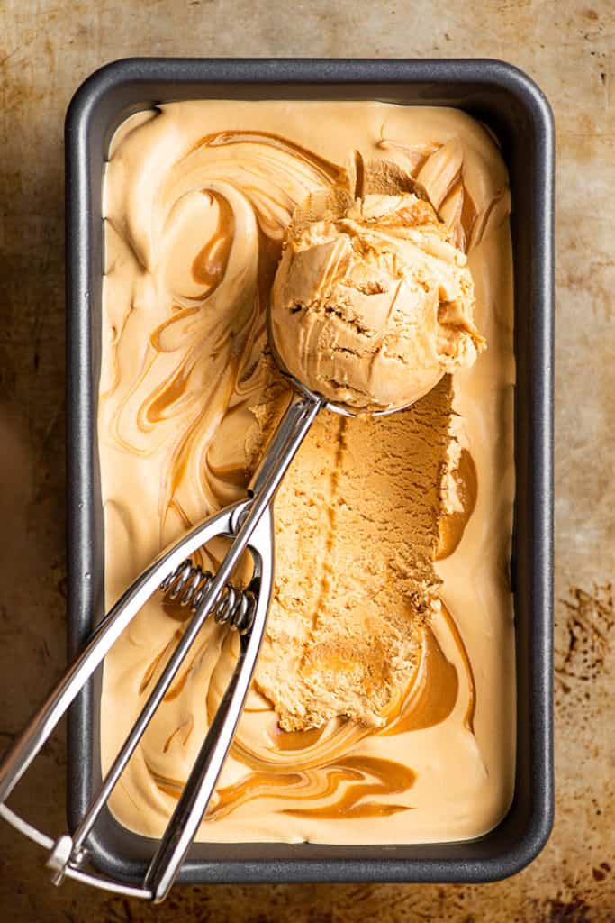 Overhead shot of Dulce de Leche Ice Cream being scooped.