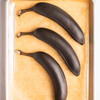 Bananas ripened in the oven on a baking sheet.