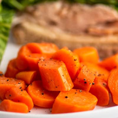 Microwave cooked carrots on a plate.