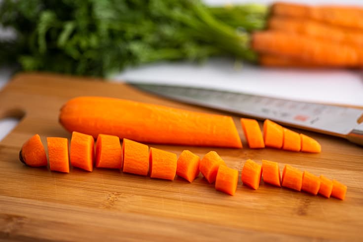 Chopped carrots on a cutting board.