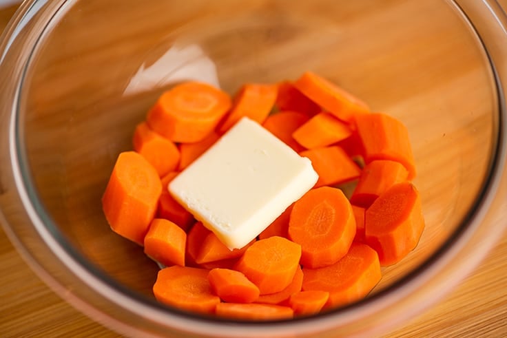 Microwave carrots in a bowl with butter.