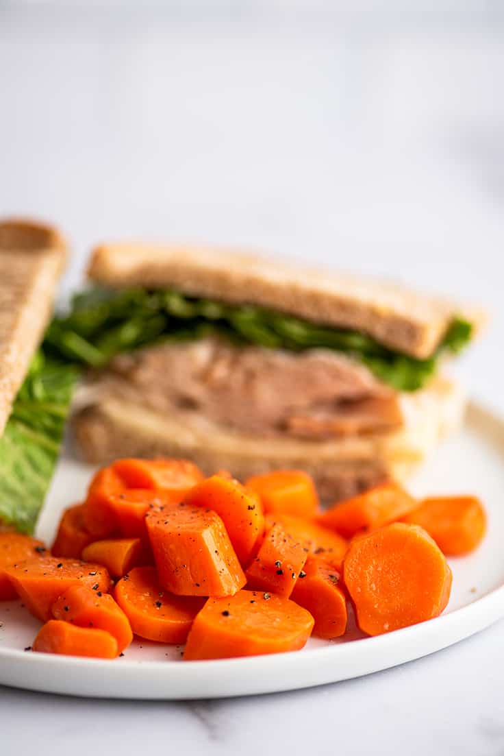 Microwave cooked carrots on a plate.