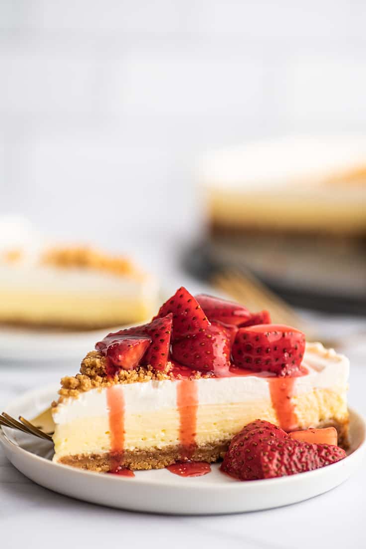 Slice of easy cheesecake with strawberry sauce.