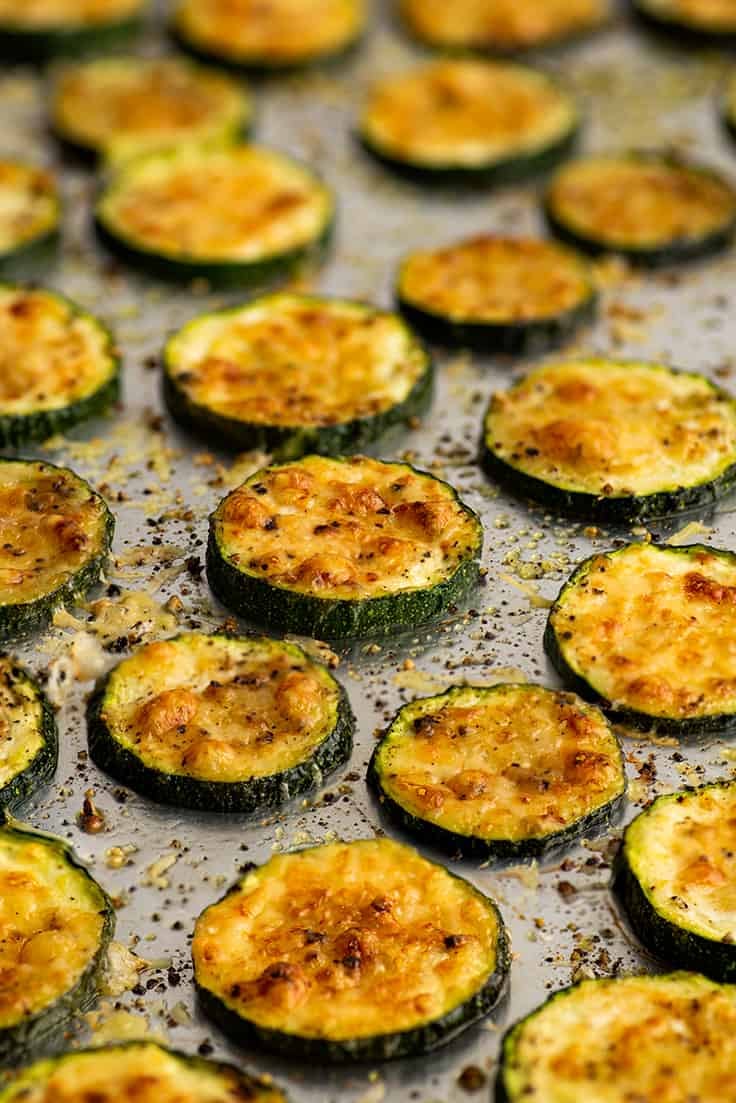 Photo of roasted parmesan zucchini on a baking tray.