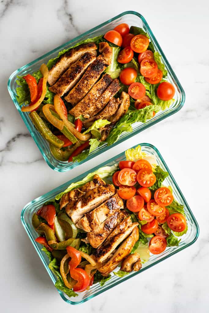 Chicken fajita salad in meal prep containers.