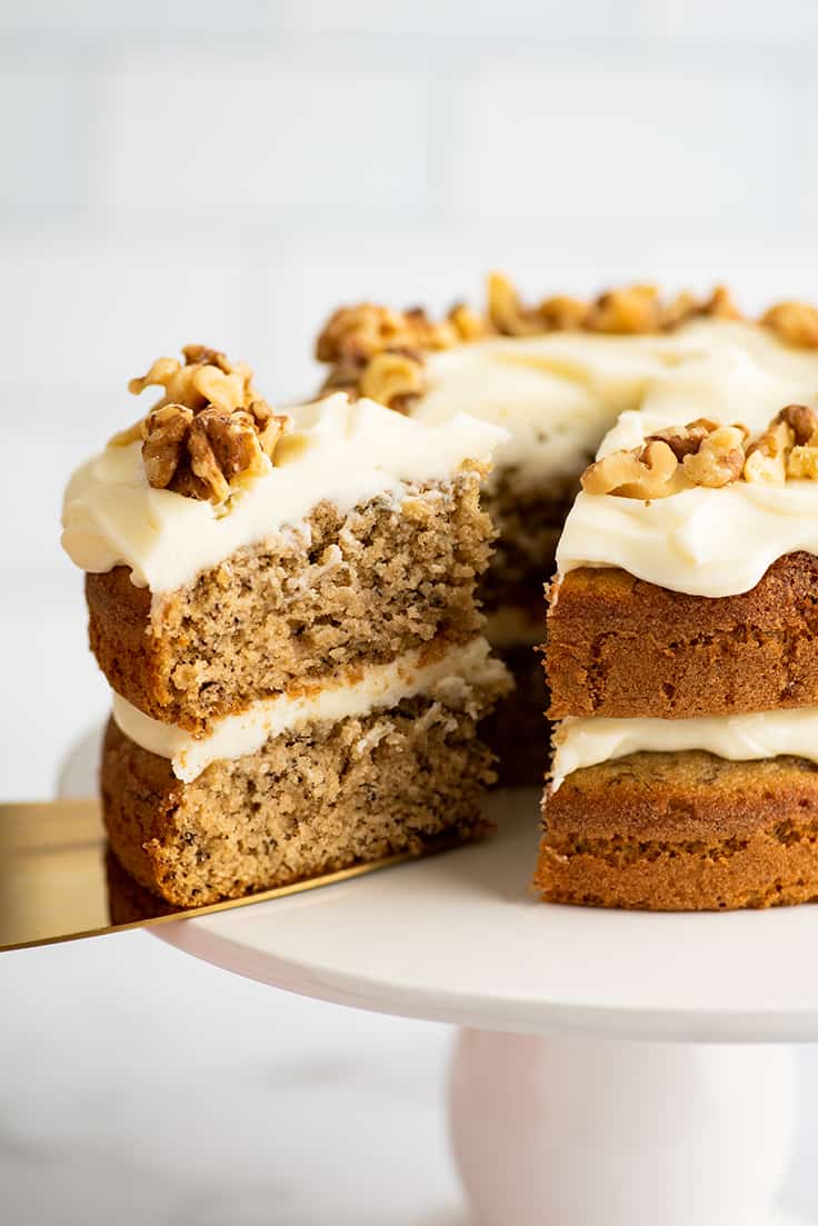 A slice of banana cake being cut.