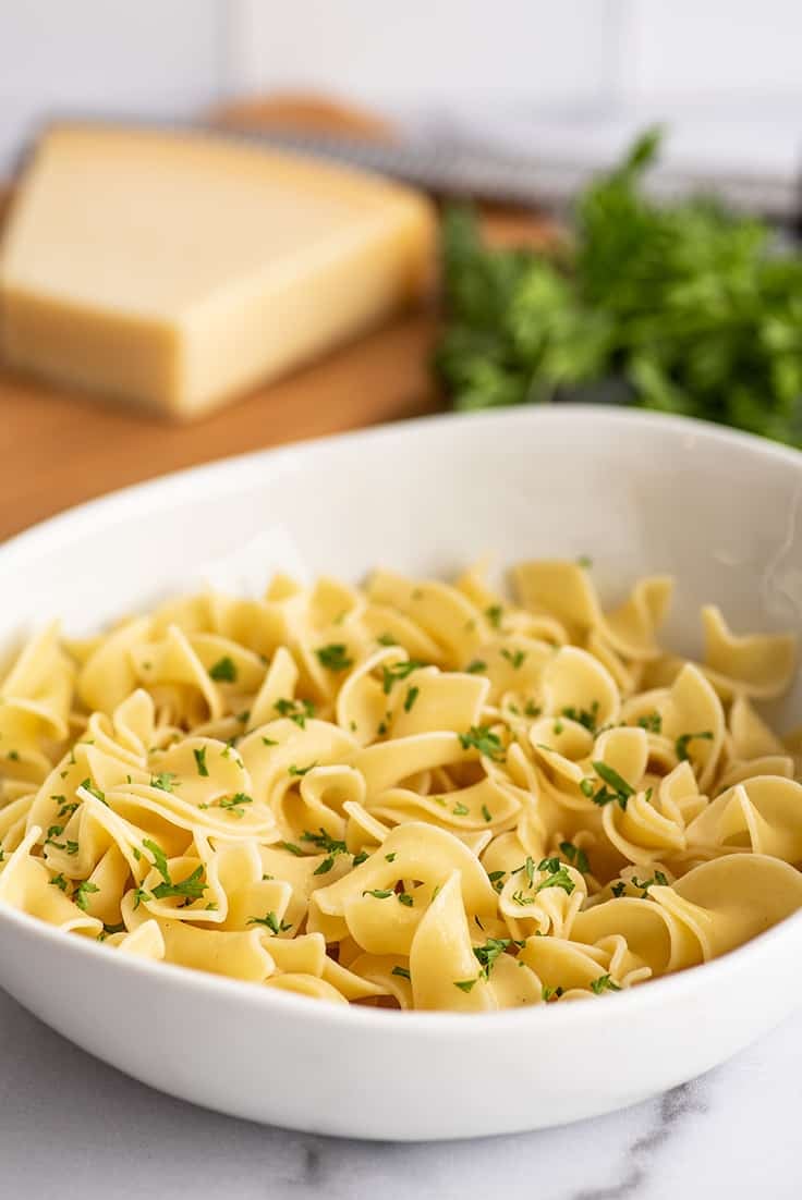 Single serving of buttered noodles in a bowl.