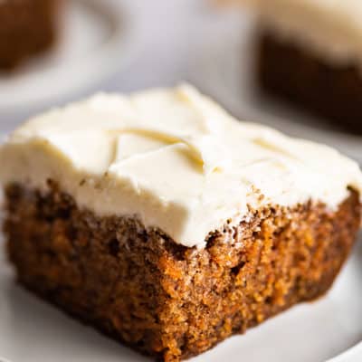 Slice of carrot cake on a plate.