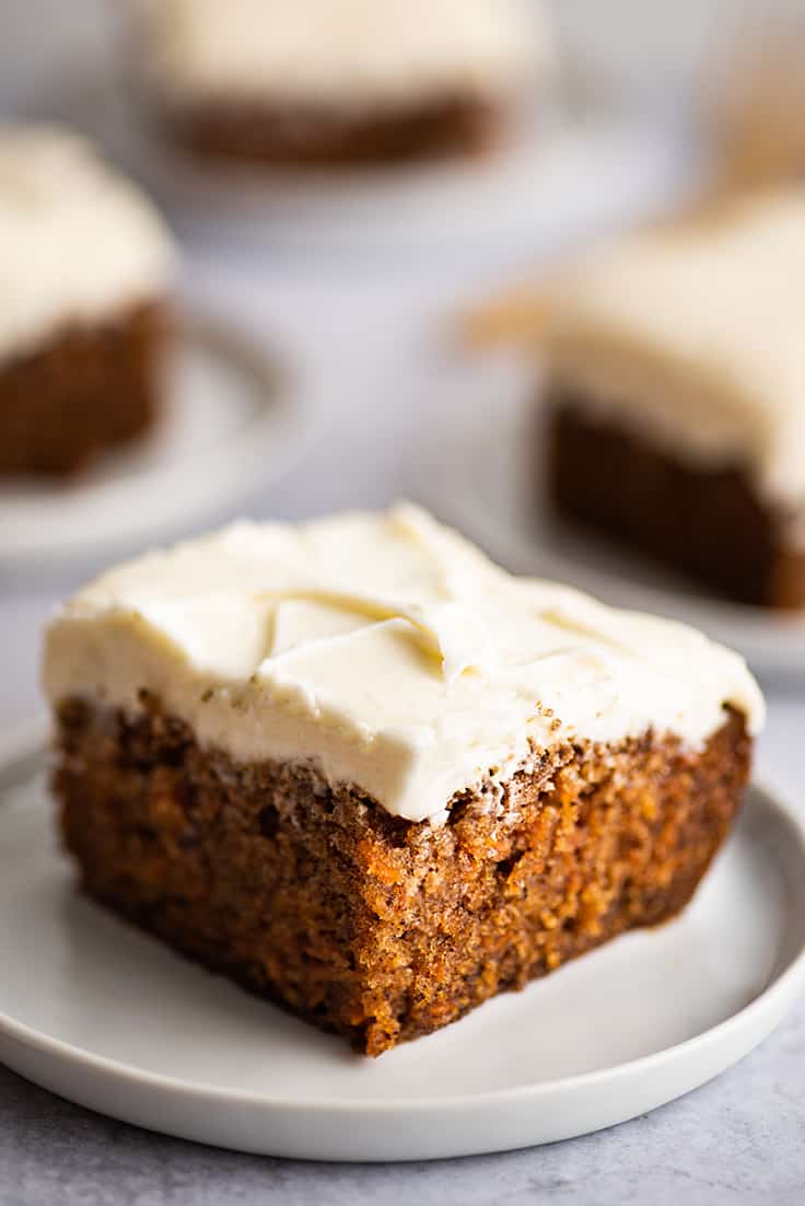 Slice of carrot cake on a plate.