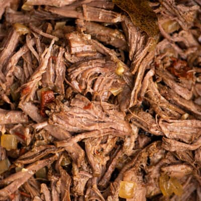 Close up photo of barbacoa beef.