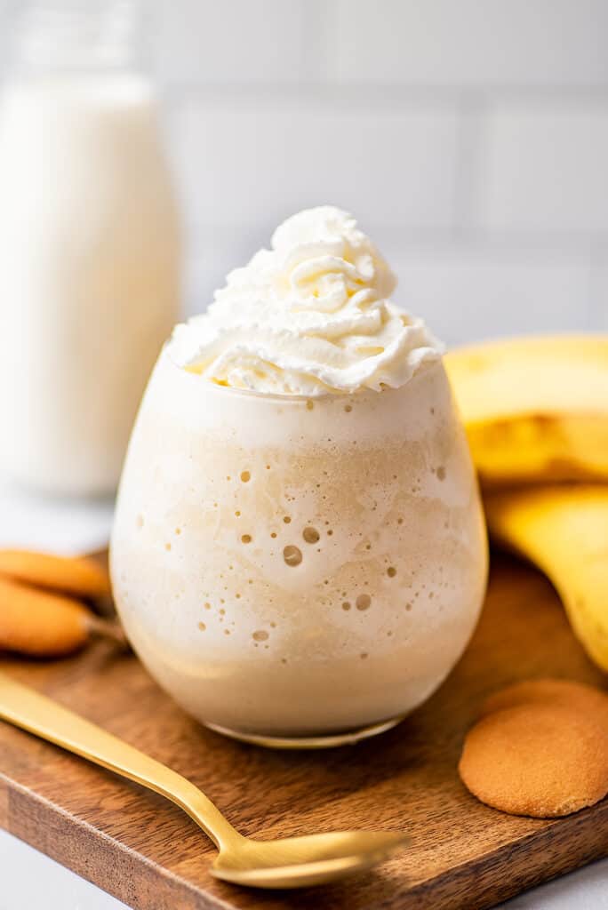 Banana milkshake without ice cream in a glass cup.