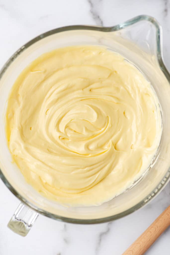 Banana pudding in a glass mixing bowl.