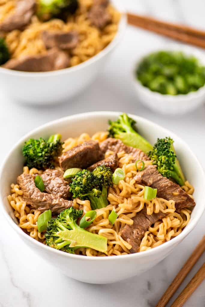 Beef ramen noodles in a white bowl.