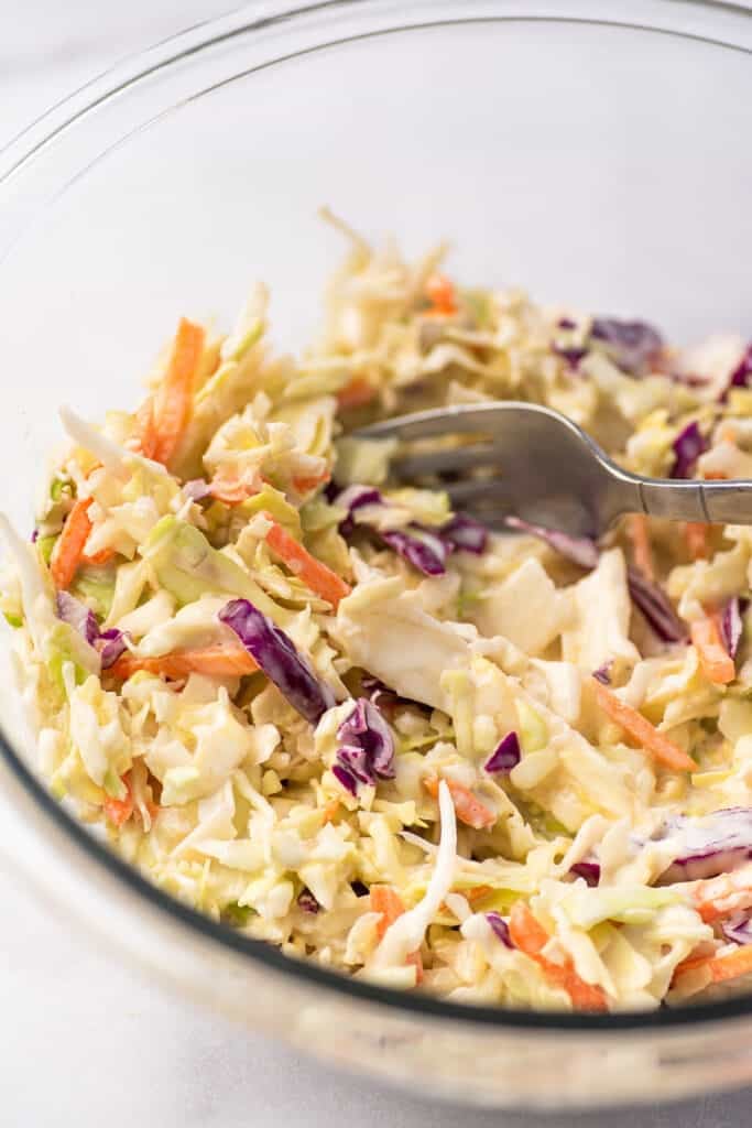 Coleslaw in a glass bowl.