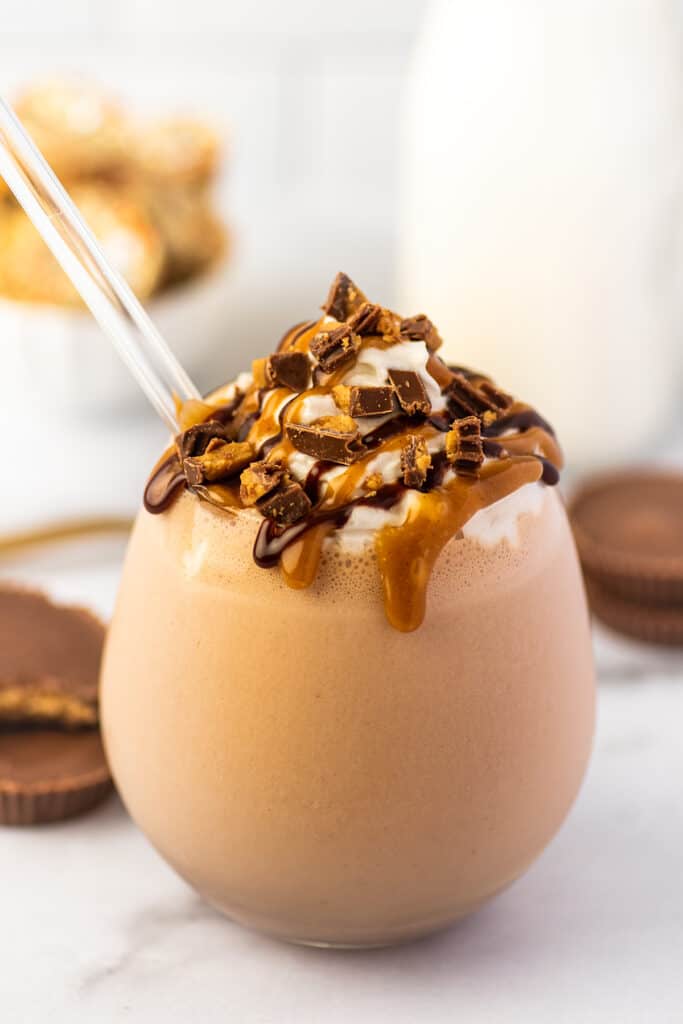 Chocolate peanut butter milkshake in a glass cup.