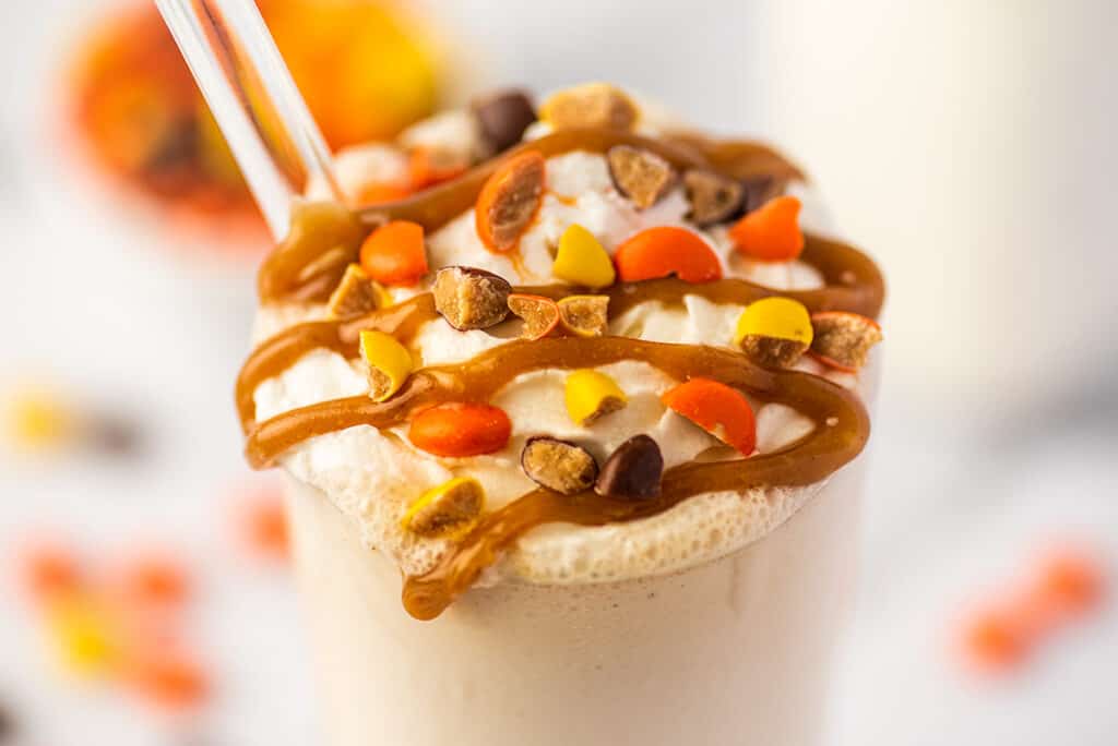 Peanut butter milkshake with whipped cream and peanut butter sauce.