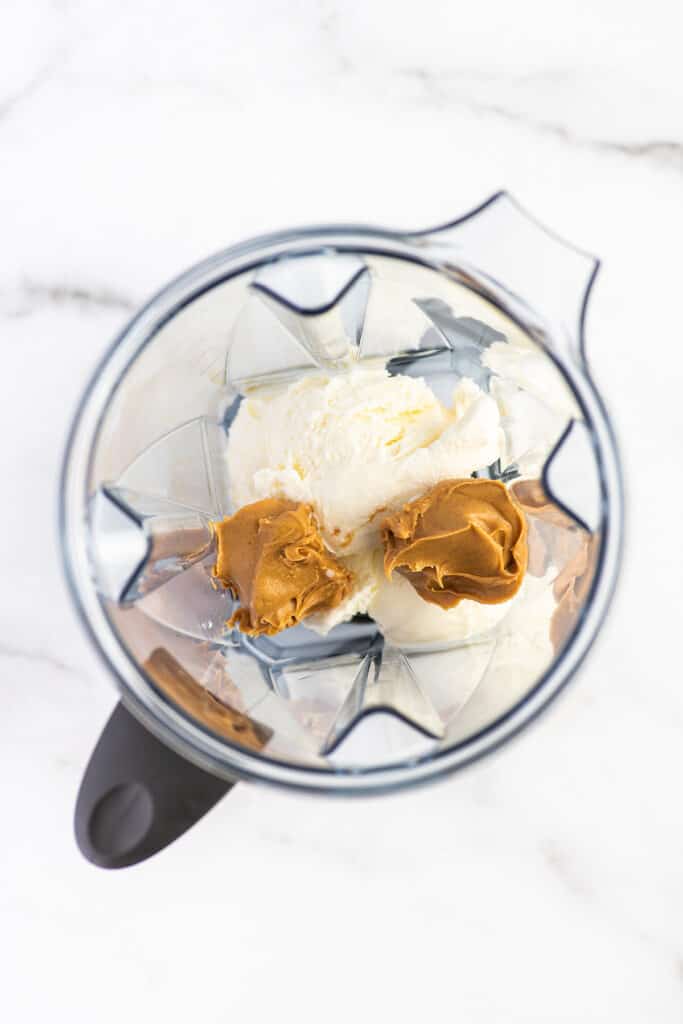 Peanut butter milkshake ingredients in a blender.