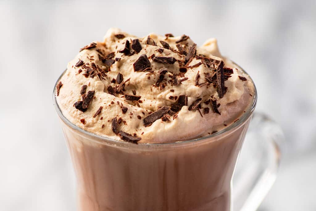 Hot chocolate with coffee whipped cream on top.