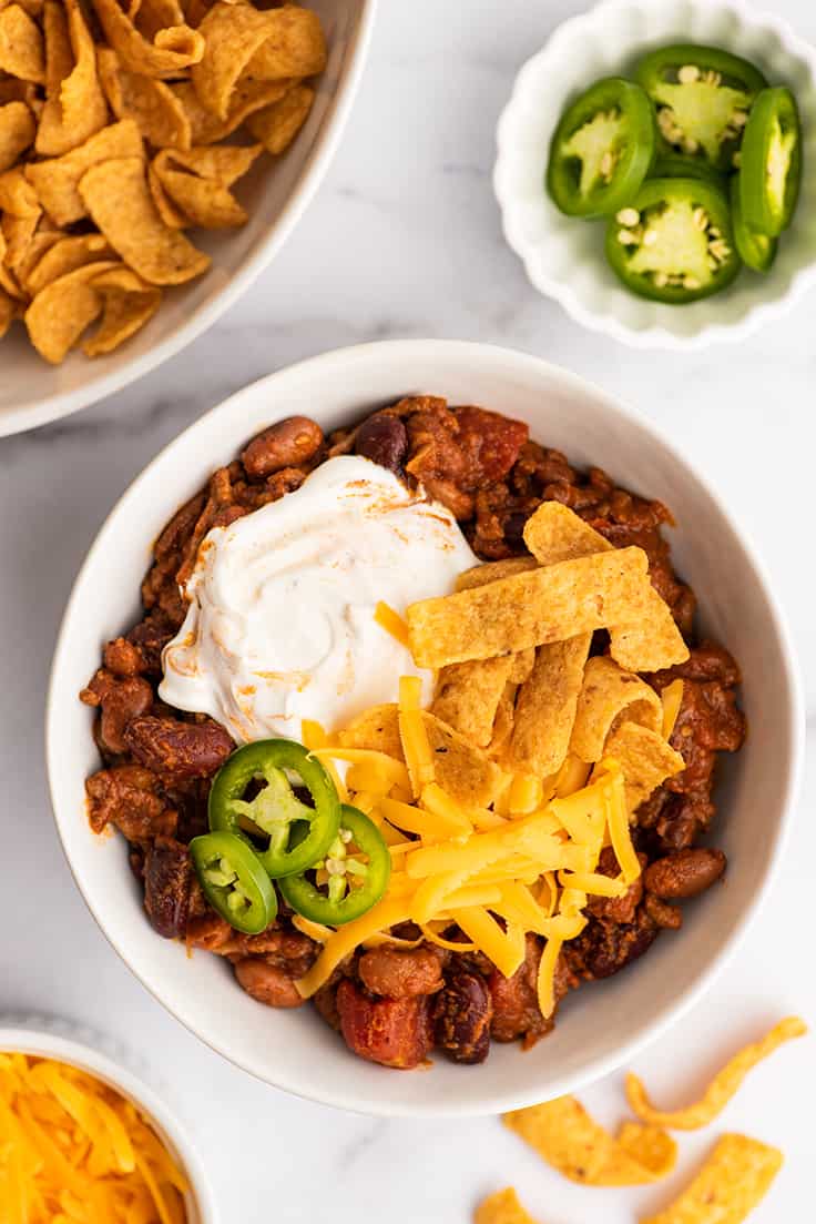 Easy chili recipe in a bowl with toppings.