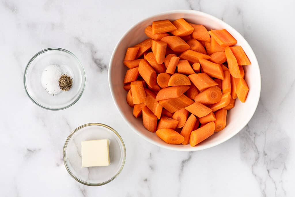 Ingredients for roasted carrots on a counter.