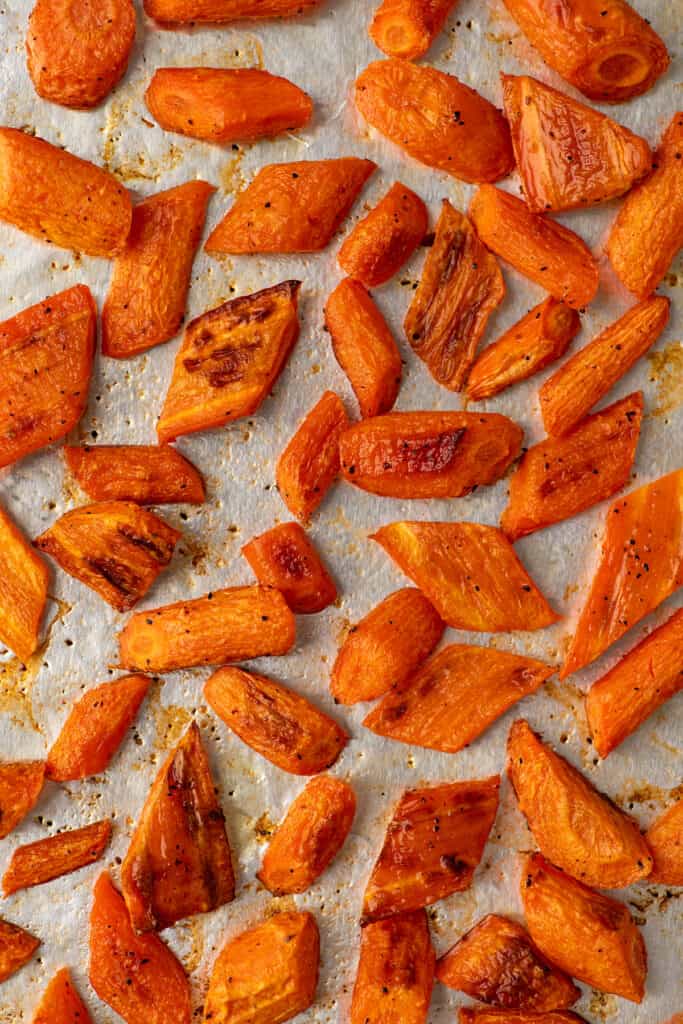 Roasted carrots on a baking sheet.