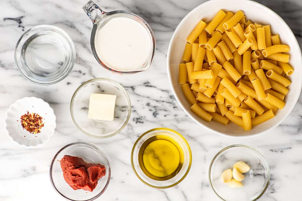 Vodka sauce ingredients on a counter.