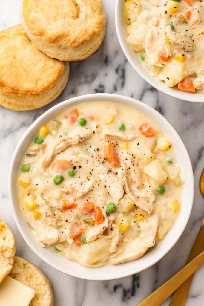 Chicken pot pie soup in a white bowl.