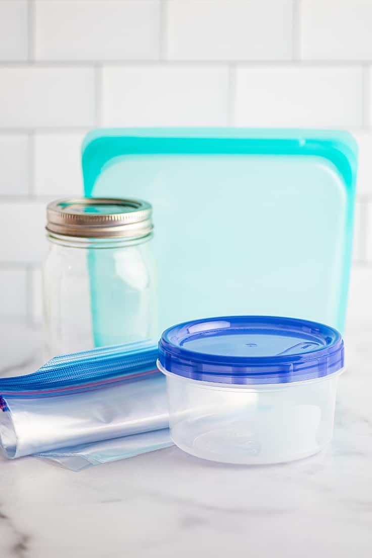 Different containers for freezing soup on a counter.