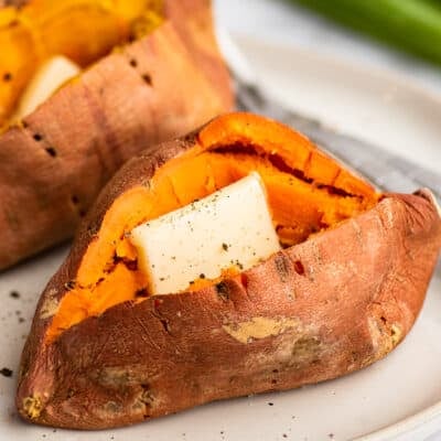 Microwave sweet potato cut open with butter and salt and pepper.