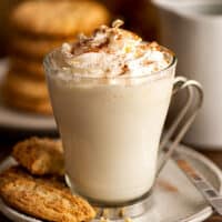 Snickerdoodle hot chocolate with whipped cream and cinnamon sprinkled on top.