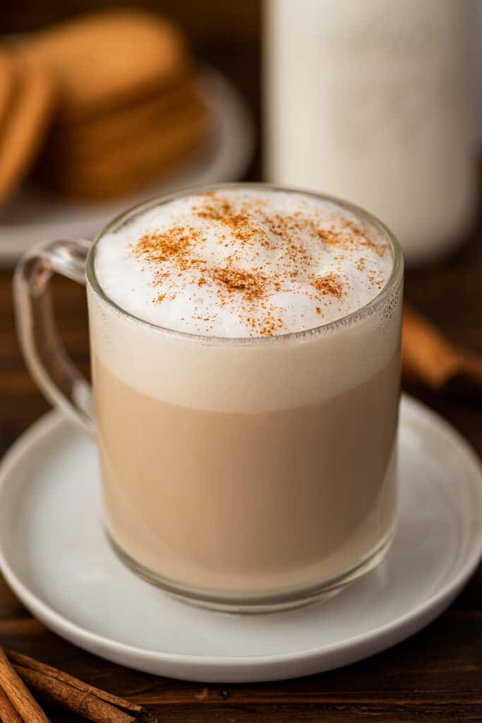 Cinnamon dolce latte in a mug with cinnamon sprinkled on top.