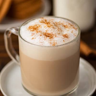 Cinnamon dolce latte in a mug with cinnamon sprinkled on top.
