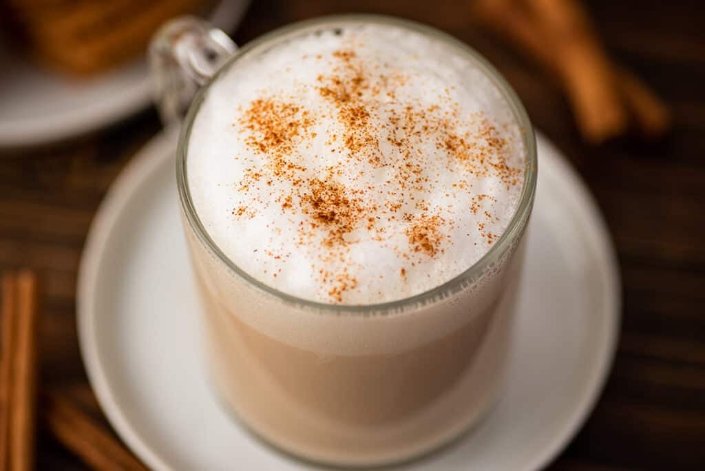 Cinnamon dolce latte in a glass mug.